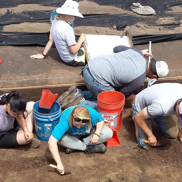 Overhead shot of Anthropology students working on the field.
