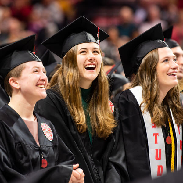 Students smile at commencement