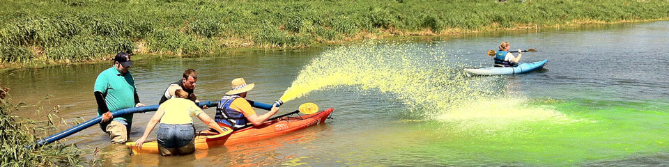 Students in kayak testing water